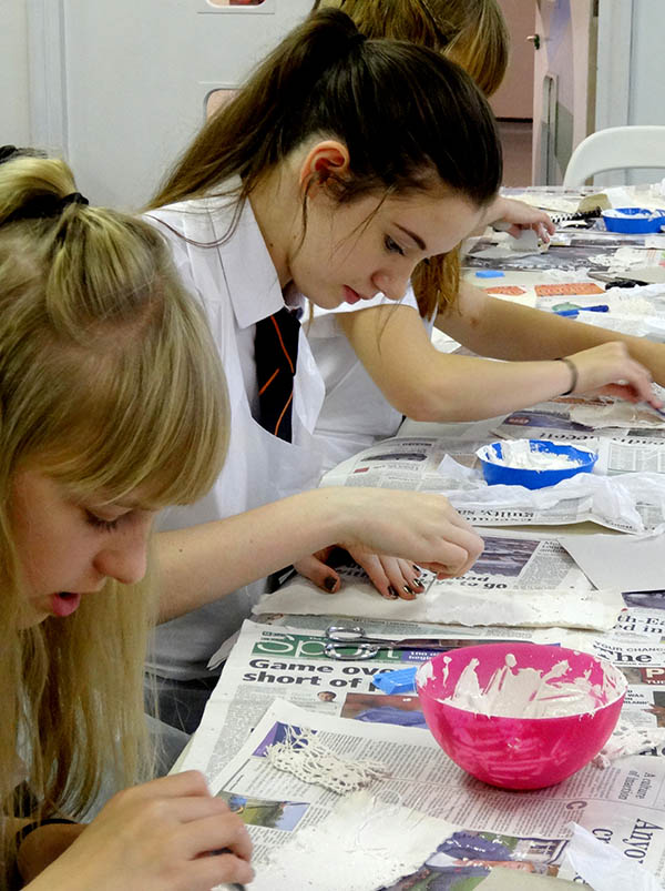 Students Work with Plaster and Textiles