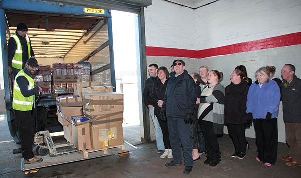 Xmas Supplies Arrive for Town’s Needy Families