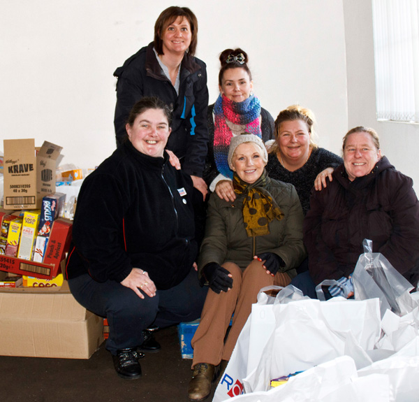 A Hundred Families Receive Food Parcels