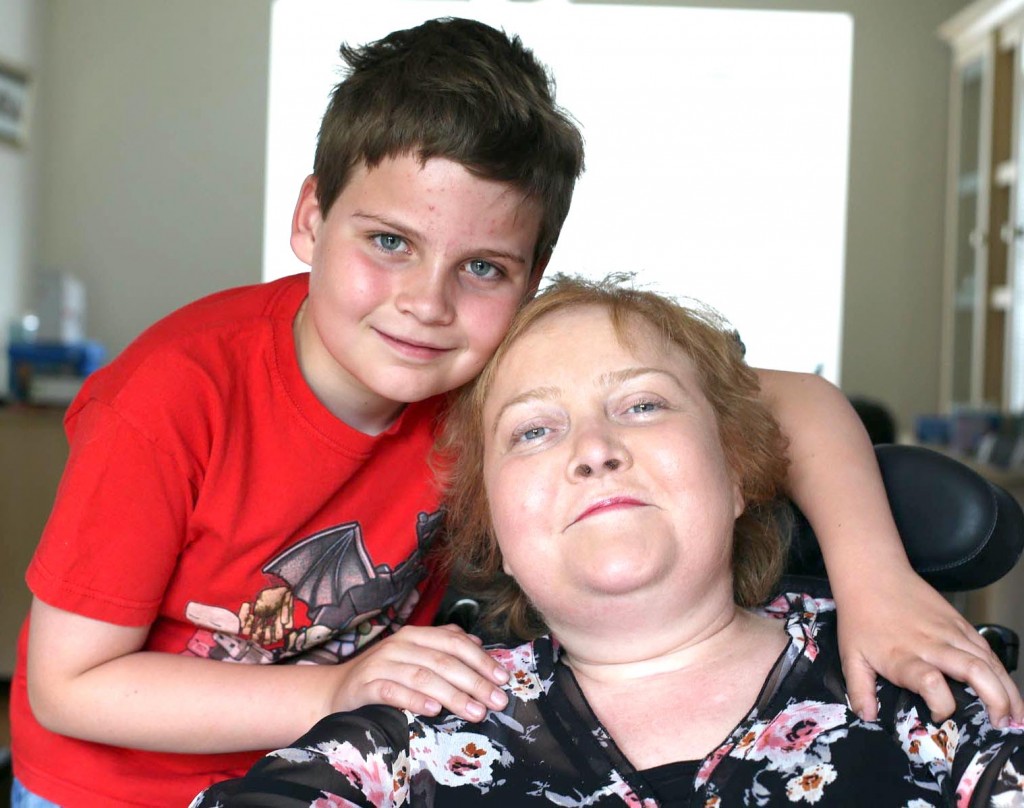 Niall Irwin (9) welcomes home mum Nicola Maull who has spent a year in hospital at Newcastle. Pictured at their family home on Cyprus Grove in Newton Aycliffe. Picture: CHRIS BOOTH