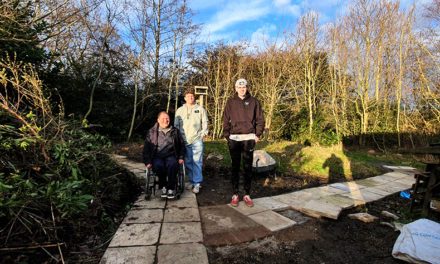 Missionaries ‘Shovel’ Support to Shape Woodland Garden